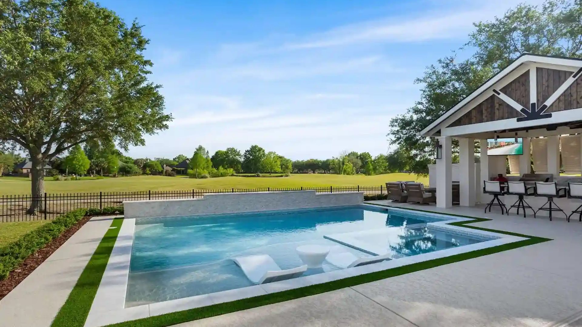 Gunite pool, sun shelf, and outdoor pavilion from the Blue Wave Pools gallery